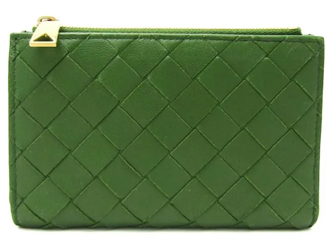 Billetera bi-fold de cuero verde oscuro Intrecciato de Bottega Veneta 