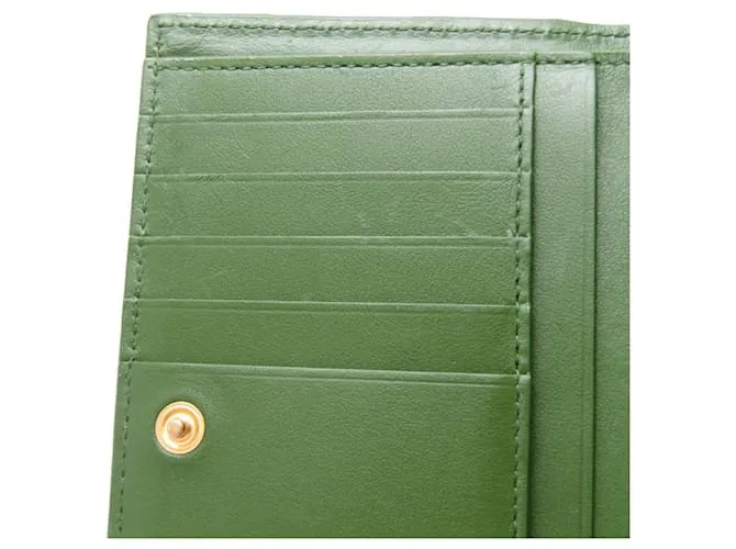 Billetera bi-fold de cuero verde oscuro Intrecciato de Bottega Veneta 