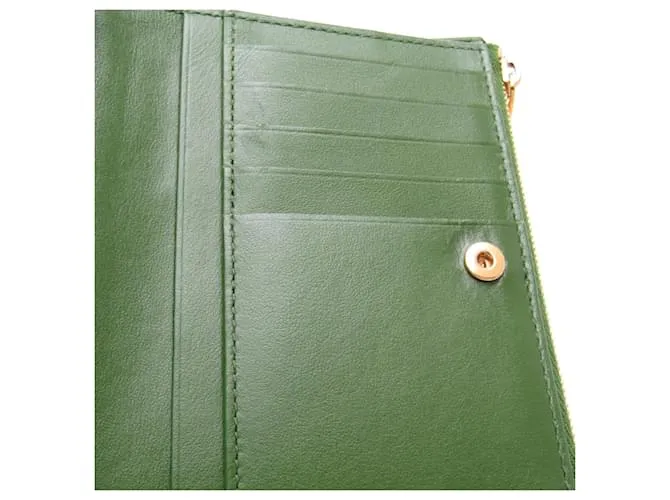 Billetera bi-fold de cuero verde oscuro Intrecciato de Bottega Veneta 