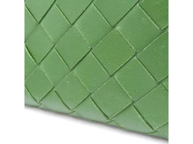 Billetera bi-fold de cuero verde oscuro Intrecciato de Bottega Veneta 