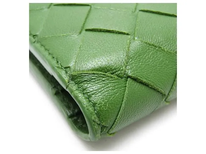 Billetera bi-fold de cuero verde oscuro Intrecciato de Bottega Veneta 