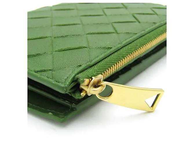 Billetera bi-fold de cuero verde oscuro Intrecciato de Bottega Veneta 