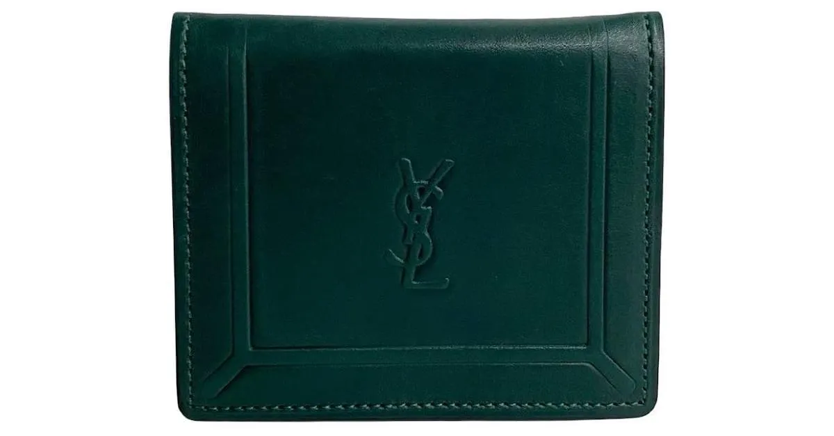 Monedero de cuero con monograma de Yves Saint Laurent. Monedero de cuero en excelente estado. Verde 