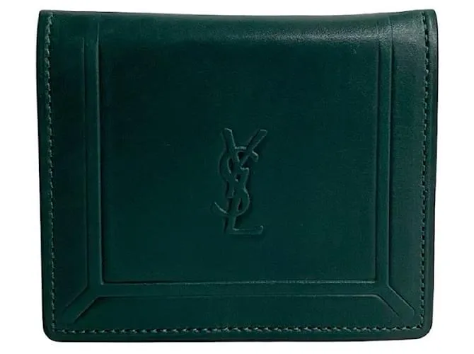 Monedero de cuero con monograma de Yves Saint Laurent. Monedero de cuero en excelente estado. Verde 